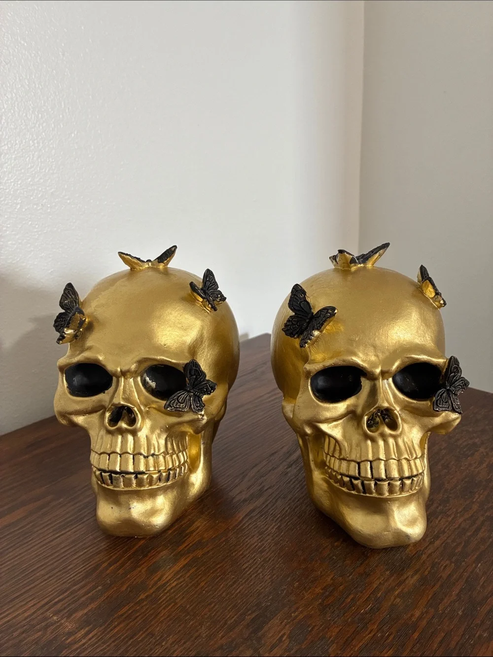 NWT- Set of 2- STUNNING- Gold Skull Statues with Black Butterflies Accents